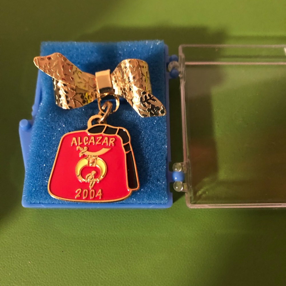 Red Alcazar 2004 Pin with Gold Bow